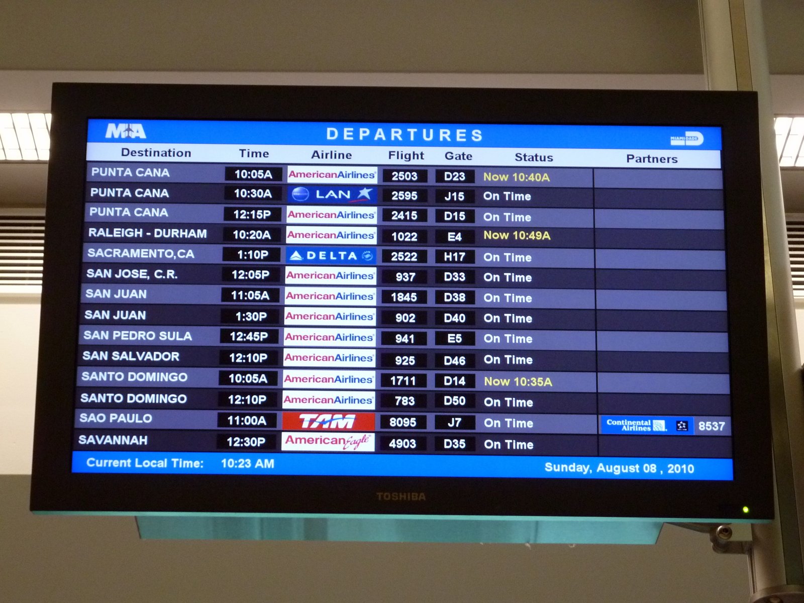 Flight departures board at Miami International Airport